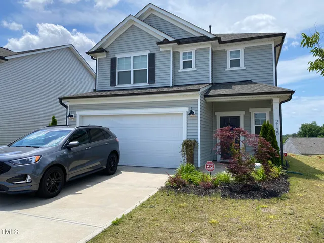 a view of a house with a garden