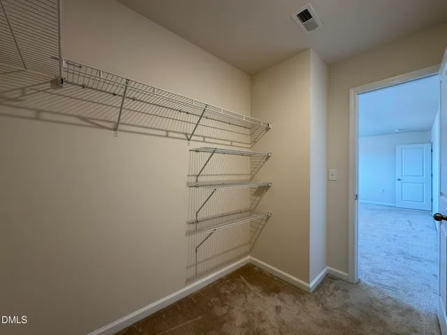 a view of a room with racks on the wall
