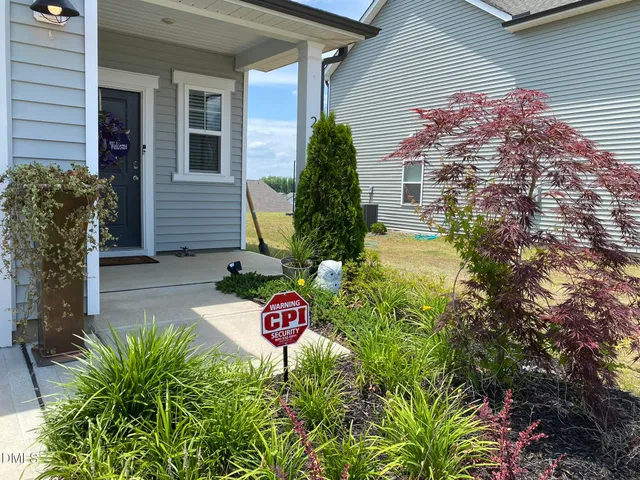 a view of a back yard of the house