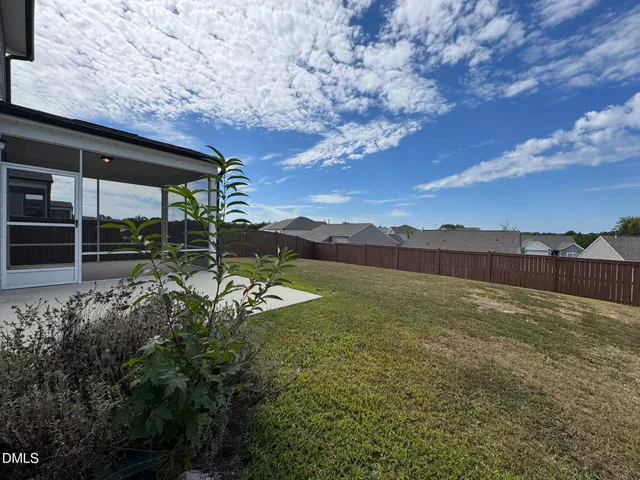 a view of a yard with an outdoor space