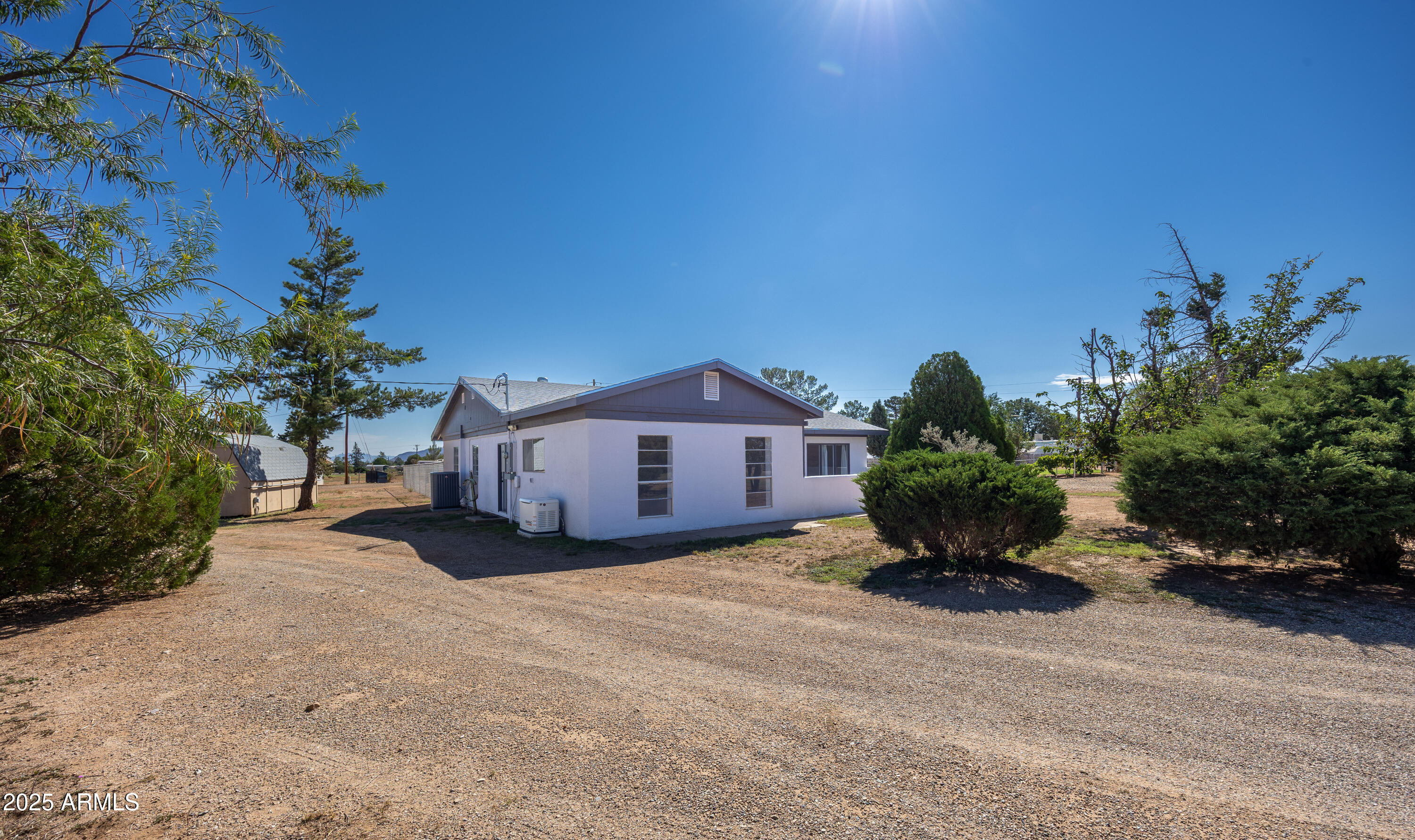 106 Neff Place Pearce, AZ 85625 - Photo 5 of 28 a large house with a large tree in front of it