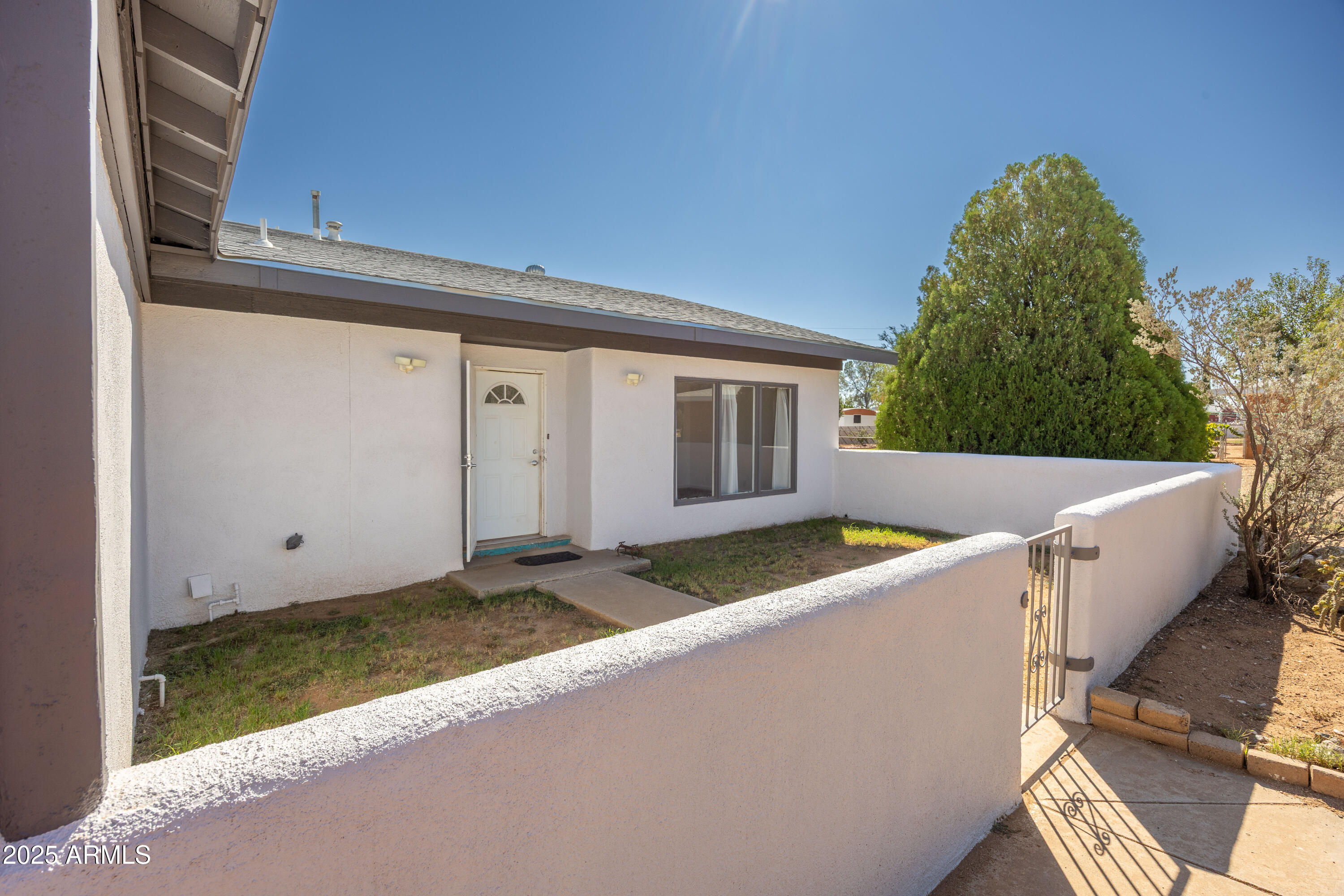 106 Neff Place Pearce, AZ 85625 - Photo 6 of 28 a view of a small house and a backyard