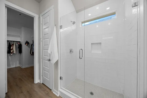 a bathroom with a double vanity sink and mirror