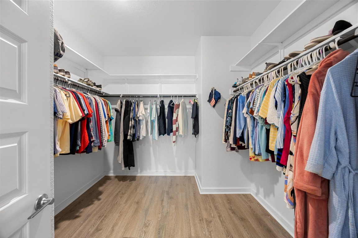 401 Peace Pipe Way Georgetown, TX 78628 - Photo 20 of 37 a view of walk in closet with clothes