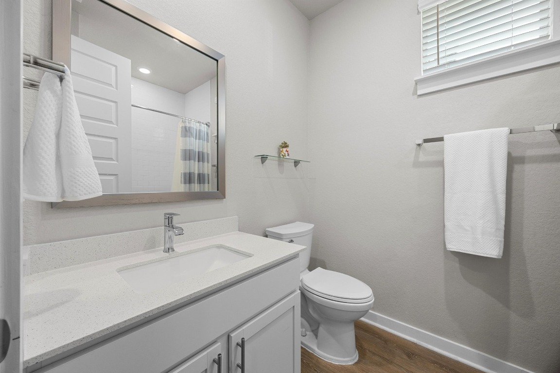 401 Peace Pipe Way Georgetown, TX 78628 - Photo 24 of 37 a bathroom with a sink a toilet and shower