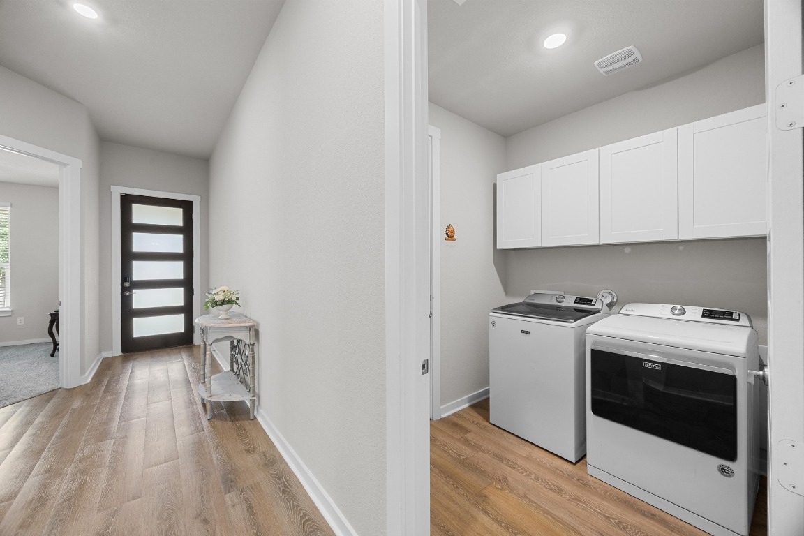 401 Peace Pipe Way Georgetown, TX 78628 - Photo 27 of 37 a kitchen with a stove and a refrigerator