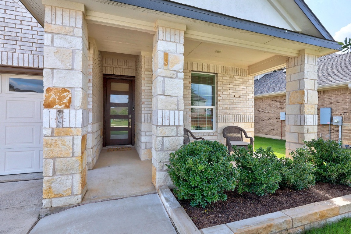 401 Peace Pipe Way Georgetown, TX 78628 - Photo 5 of 37 a front view of a house with a yard