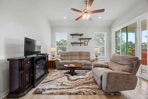 a view of a dining room with furniture and a wooden floor