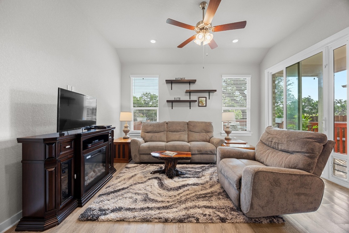 401 Peace Pipe Way Georgetown, TX 78628 - Photo 7 of 37 a living room with furniture and a flat screen tv