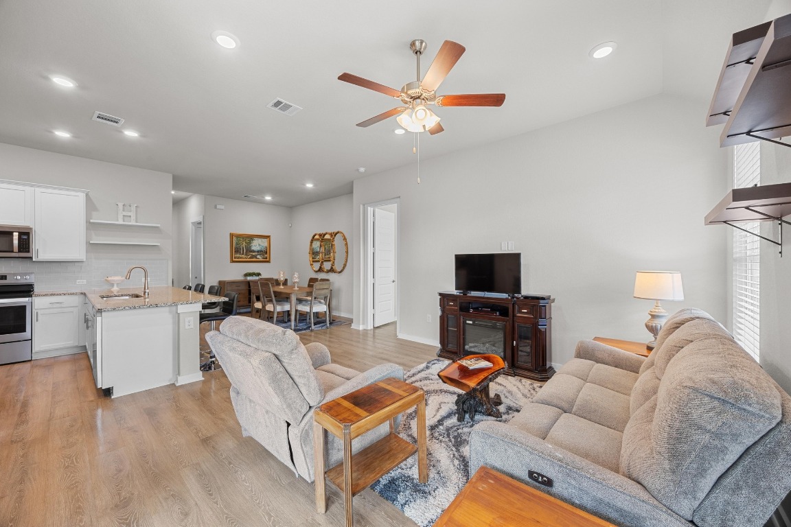 401 Peace Pipe Way Georgetown, TX 78628 - Photo 9 of 37 a living room with furniture and a flat screen tv