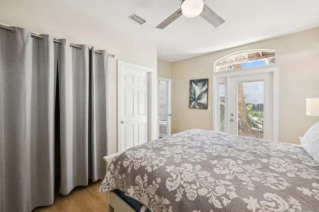 a bathroom with a granite countertop toilet a sink and a mirror