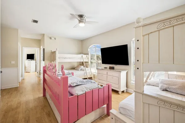 a bedroom with a bed and a couch