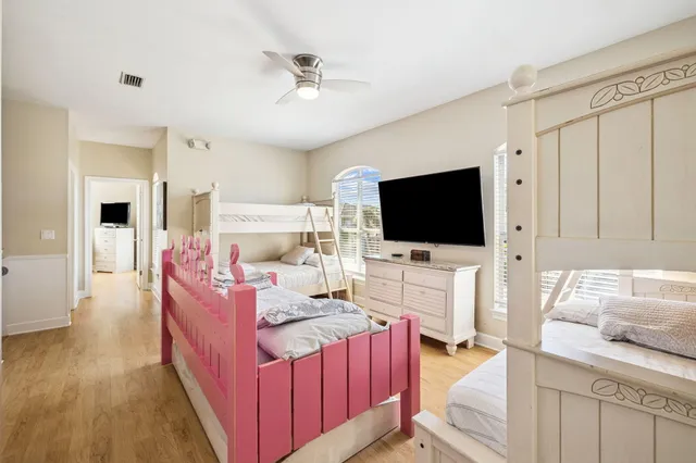 a bedroom with a bed and a couch