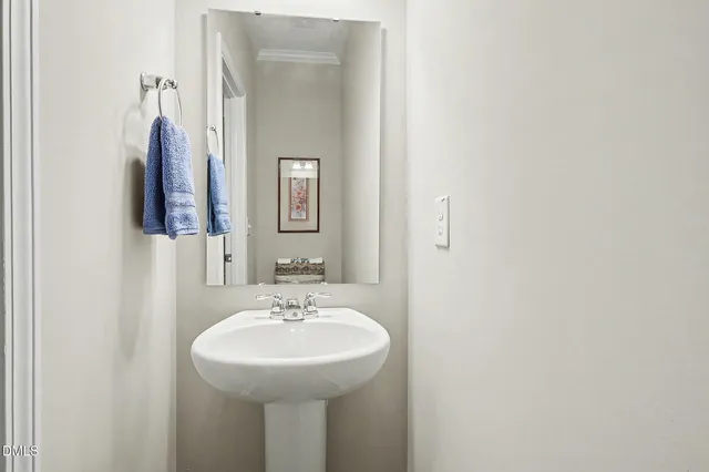 a living room with furniture and a book shelf