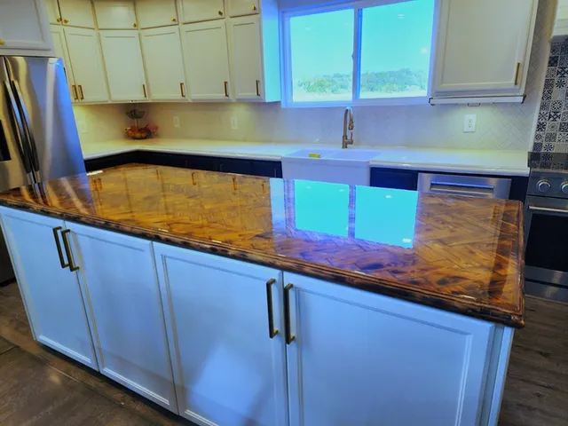 a kitchen with stainless steel appliances wooden cabinets sink and window