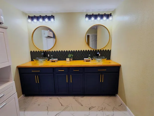 a bathroom with a toilet and a shower curtain