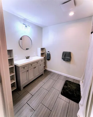 a view of room with furniture and wooden floor