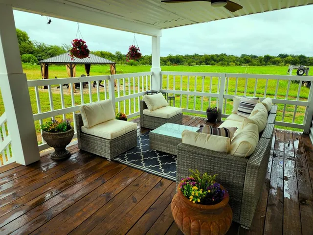 a outdoor living space with furniture and garden view
