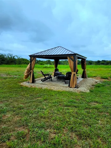 an outdoor space with furniture and garden