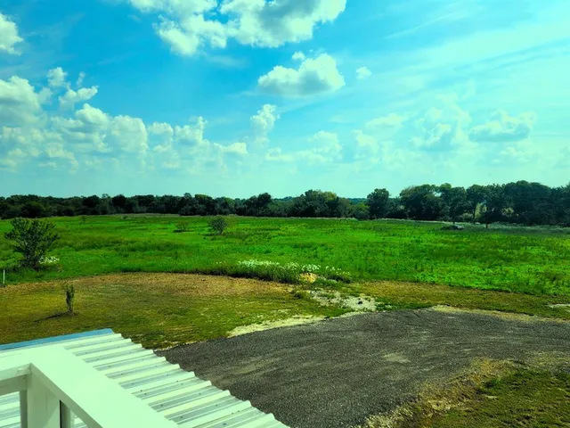 a view of a golf course with a garden