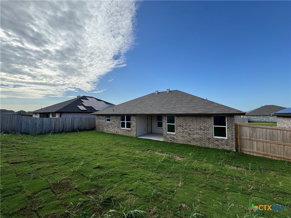 149 Atlas Avenue Killeen, TX 76542 - Photo 11 of 11 a view of a house with a yard and wooden fence