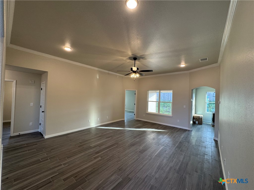 149 Atlas Avenue Killeen, TX 76542 - Photo 3 of 15 an empty room with wooden floor and windows