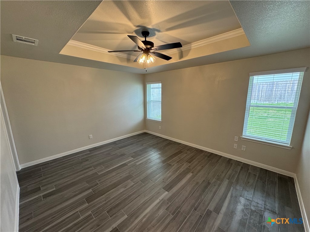 149 Atlas Avenue Killeen, TX 76542 - Photo 9 of 15 a view of an empty room with wooden floor and a window