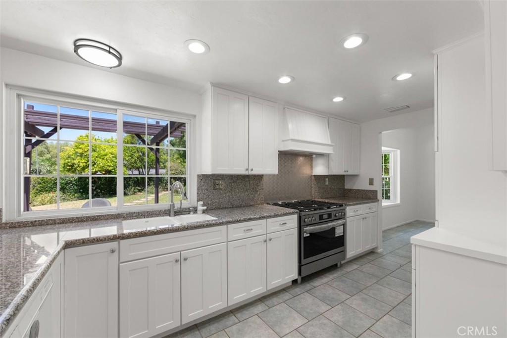 175 Wrangler Road Simi Valley, CA 93065 - Photo 13 of 52 a kitchen with a sink stove and cabinets
