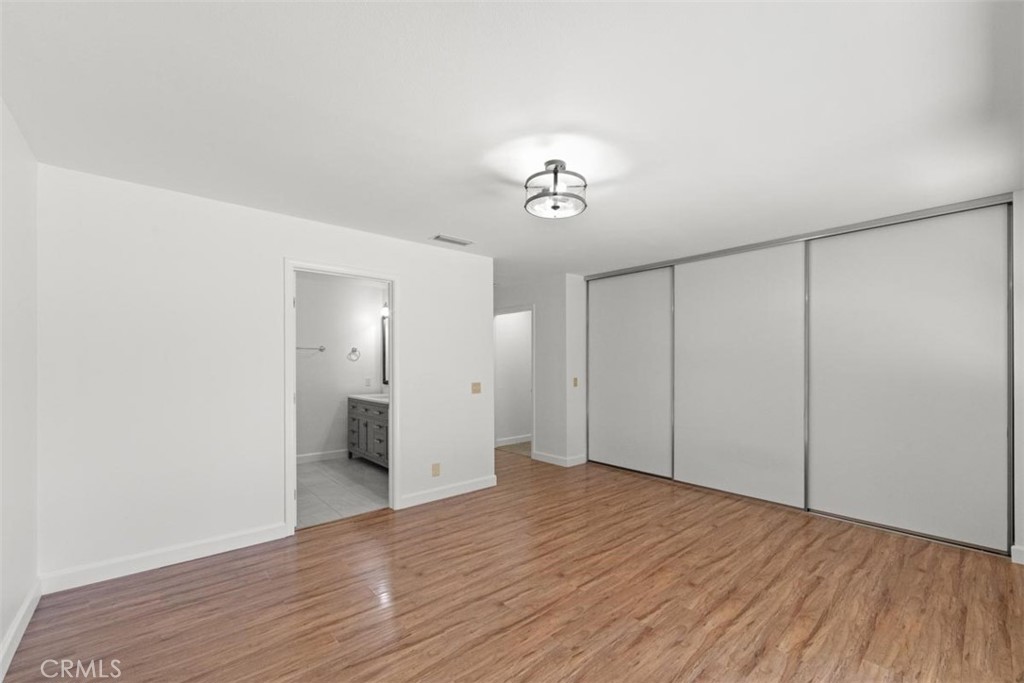 175 Wrangler Road Simi Valley, CA 93065 - Photo 17 of 52 a view of empty room with wooden floor