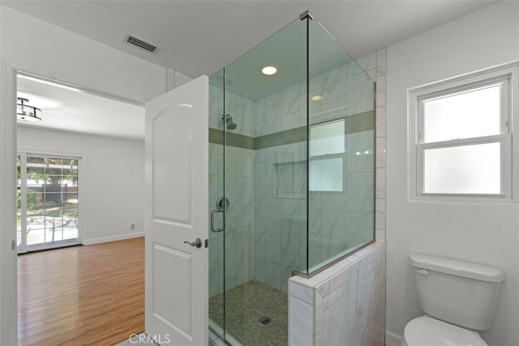 175 Wrangler Road Simi Valley, CA 93065 - Photo 20 of 52 a bathroom with a shower a toilet and a sink