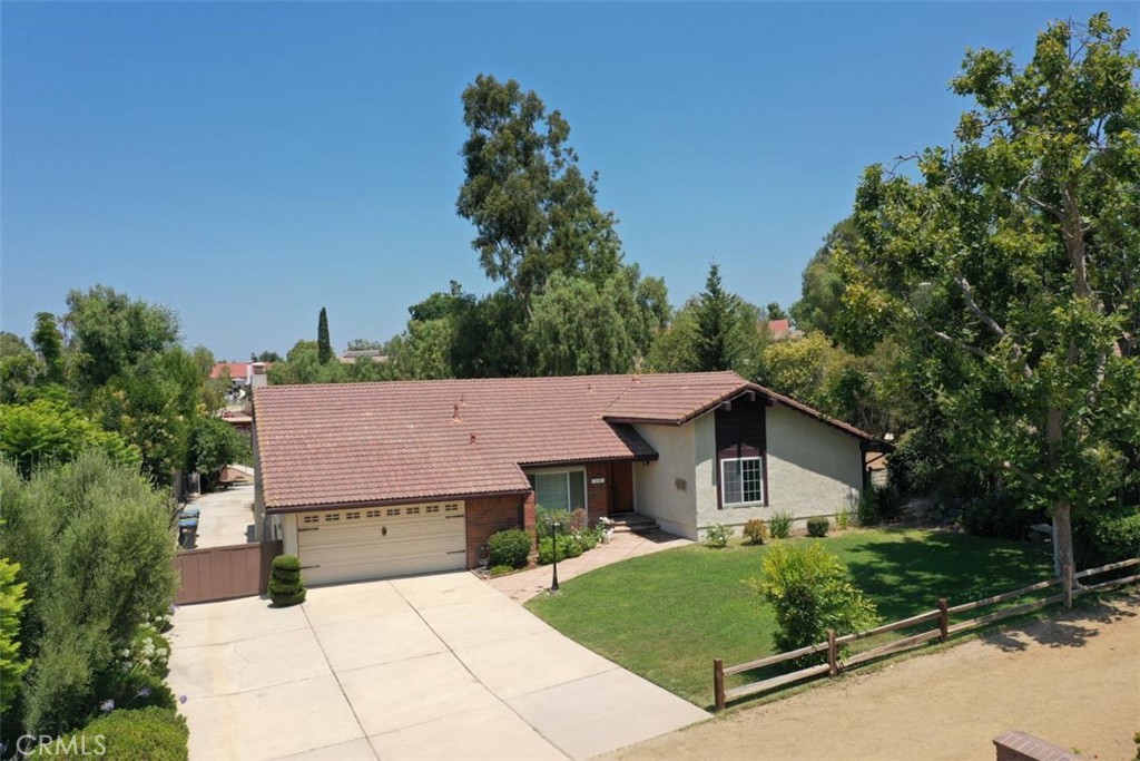 175 Wrangler Road Simi Valley, CA 93065 - Photo 2 of 52 a aerial view of a house with yard and large trees