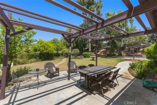 a view of a backyard with sitting area