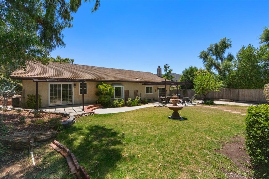 175 Wrangler Road Simi Valley, CA 93065 - Photo 23 of 52 a view of a house with swimming pool and sitting area