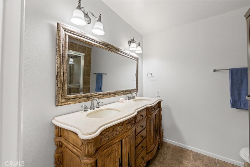 175 Wrangler Road Simi Valley, CA 93065 - Photo 39 of 52 a bathroom with a sink and a mirror