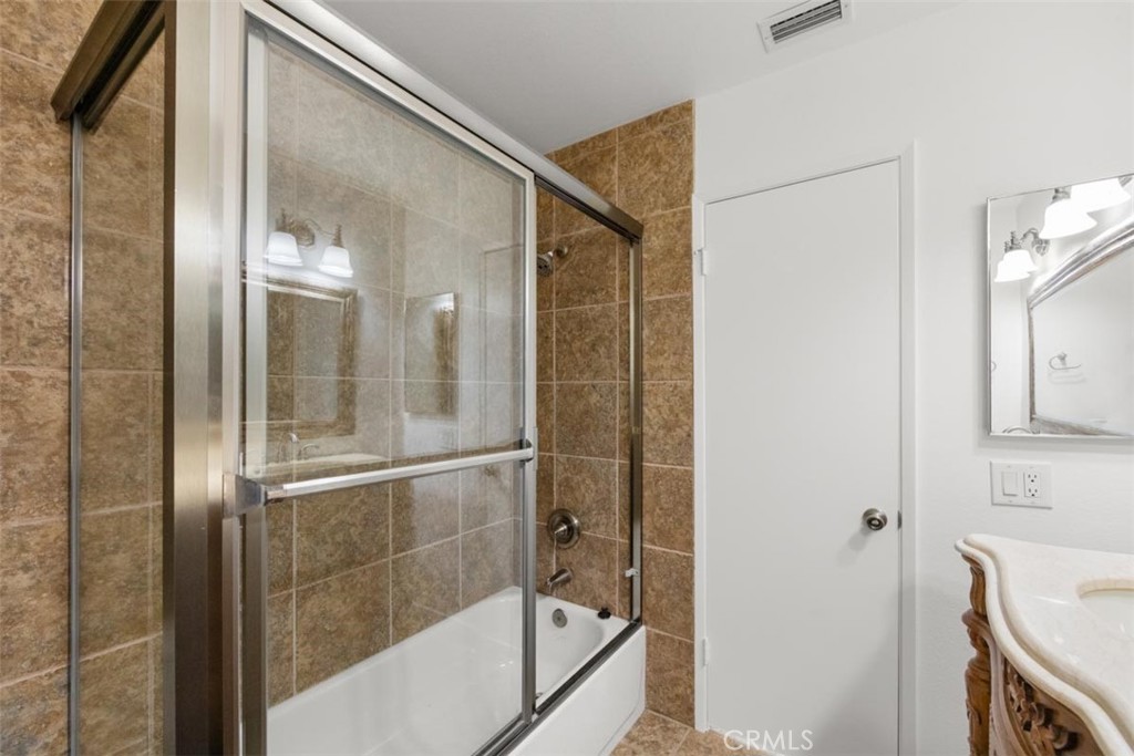 175 Wrangler Road Simi Valley, CA 93065 - Photo 40 of 52 a bathroom with a glass shower door