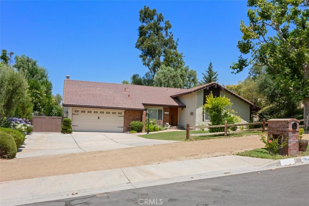 175 Wrangler Road Simi Valley, CA 93065 - Photo 4 of 52 front view of a house with a yard