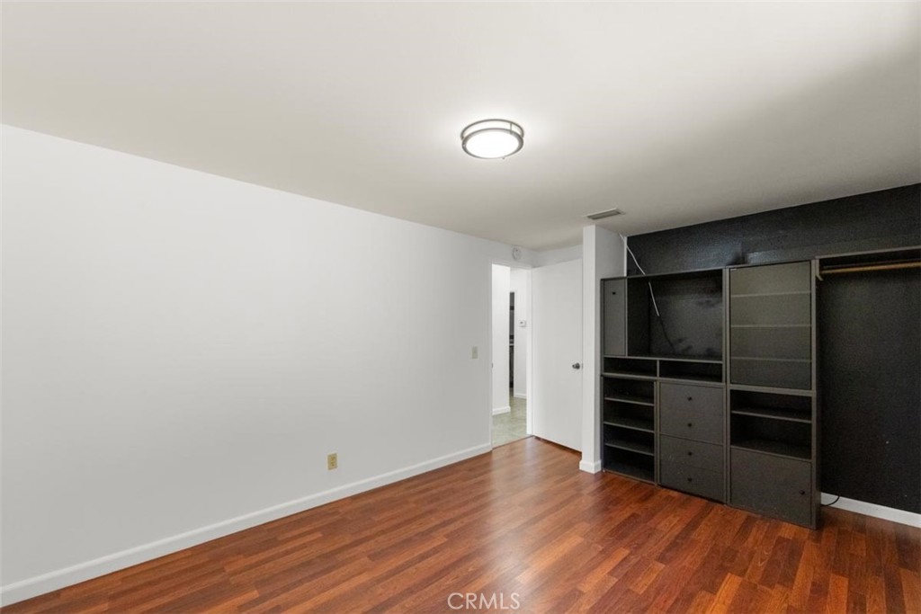 175 Wrangler Road Simi Valley, CA 93065 - Photo 41 of 52 a view of an empty room with wooden floor