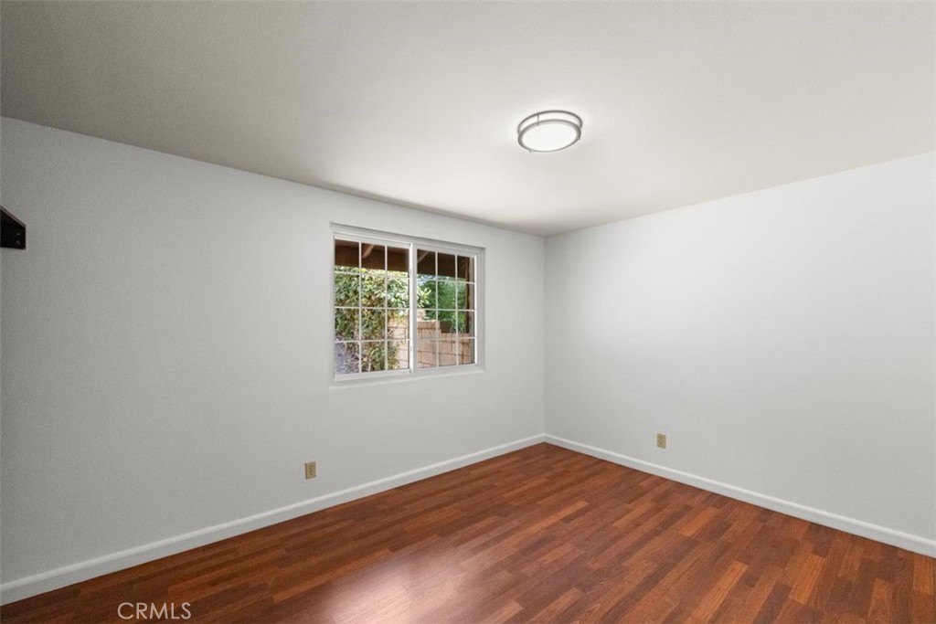 175 Wrangler Road Simi Valley, CA 93065 - Photo 42 of 52 an empty room with wooden floor and windows