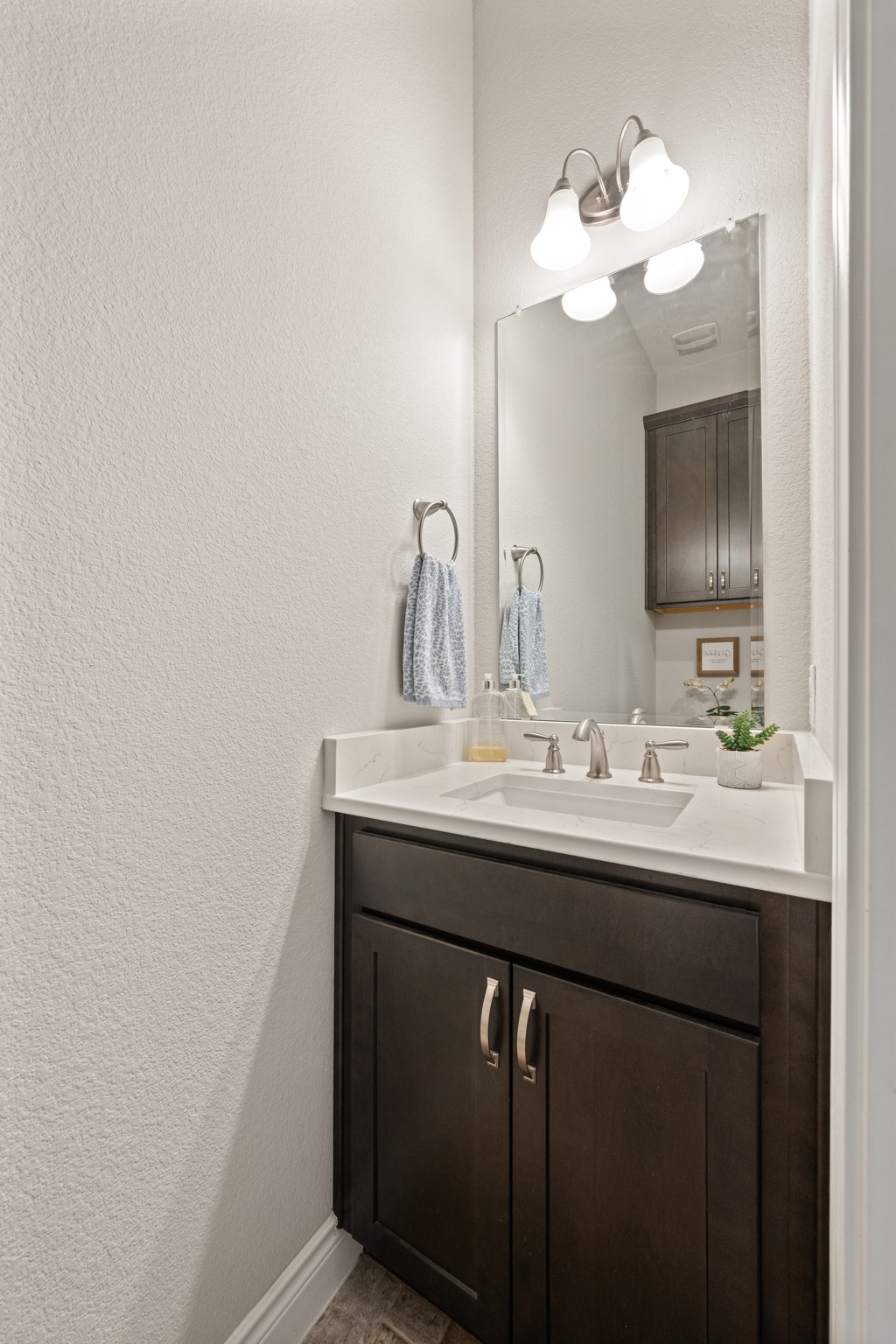 372 Adams Street Georgetown, TX 78628 - Photo 18 of 33 a bathroom with a sink and a mirror