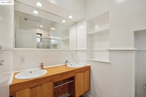 a view of a hallway with windows and entryway