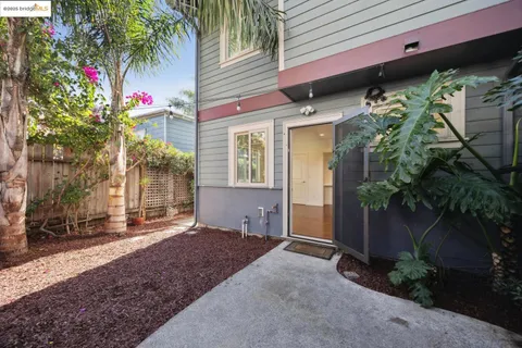 a view of a house with a small backyard