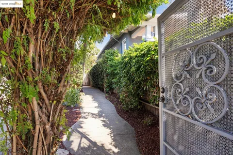 a pathway of a house with a yard