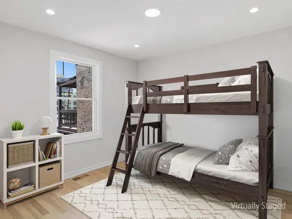 a bedroom with furniture and a window