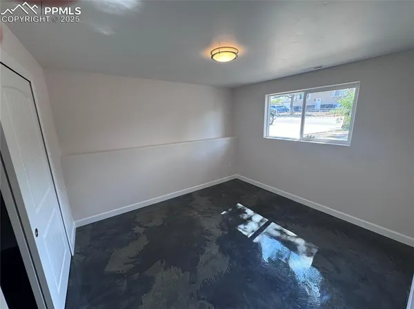 an empty room with windows