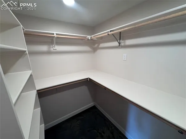 a bathroom with double vanity and a mirror