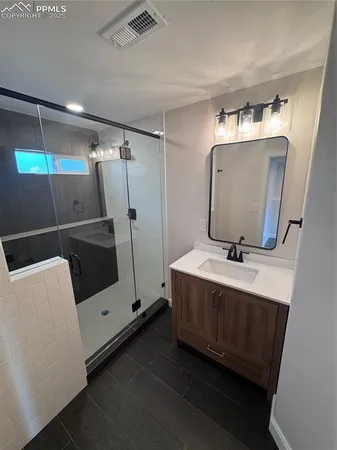 a view of storage and utility room with wooden floor