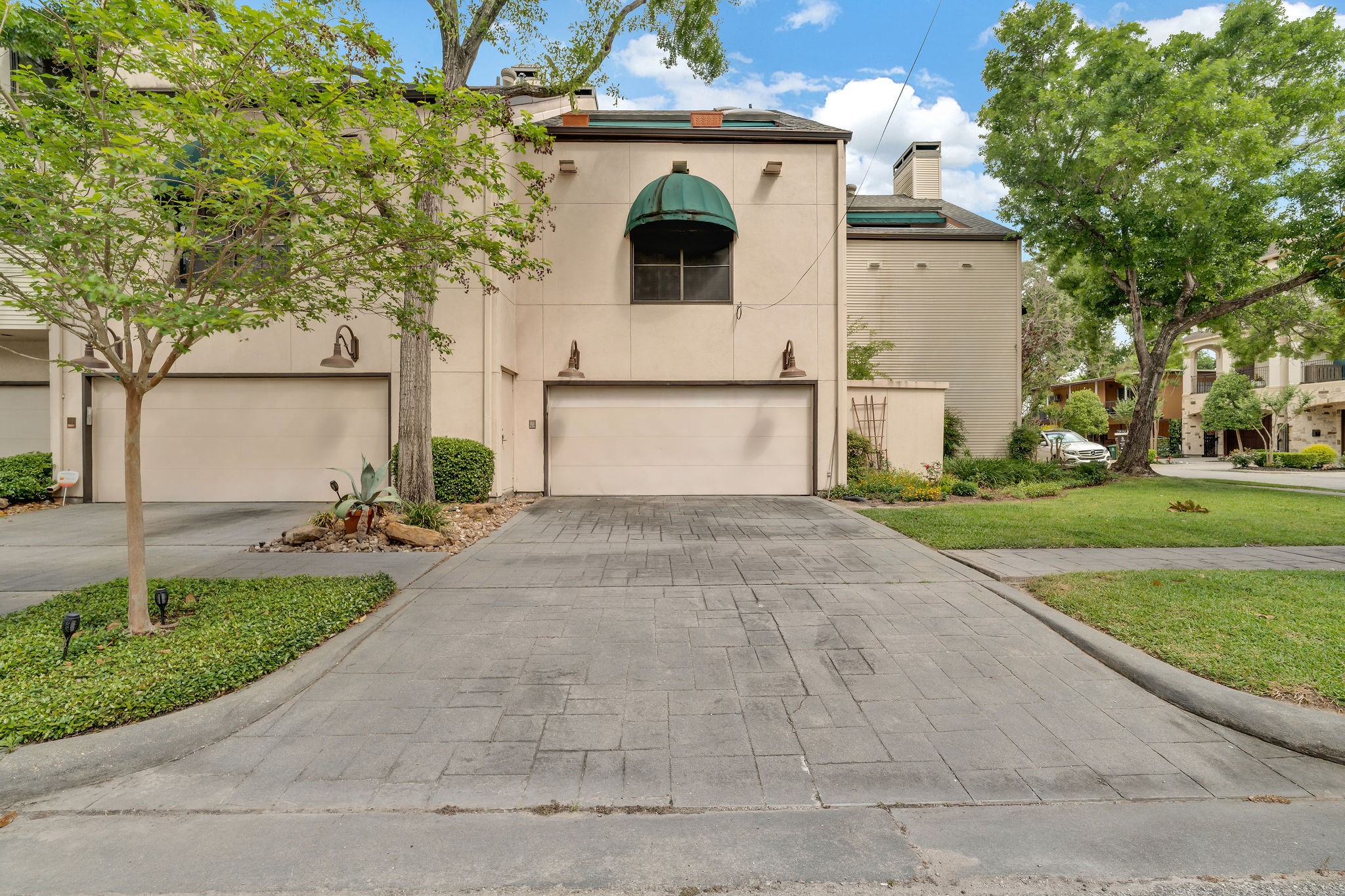 a front view of a house with garden