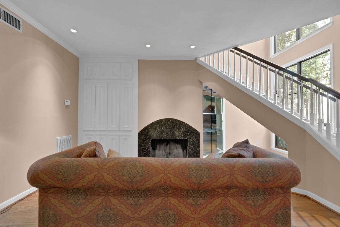 5084 Augusta Street Houston, TX 77007 - Photo 12 of 43 a bedroom with a bed and a ceiling fan