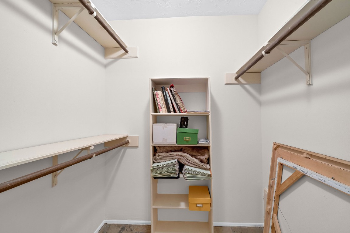 5084 Augusta Street Houston, TX 77007 - Photo 29 of 43 Walk-in guest bedroom closet with multiple shelves and hanging rods.