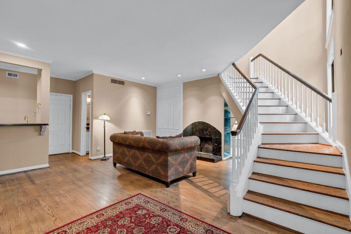 5084 Augusta Street Houston, TX 77007 - Photo 5 of 43 a living room with furniture and a rug